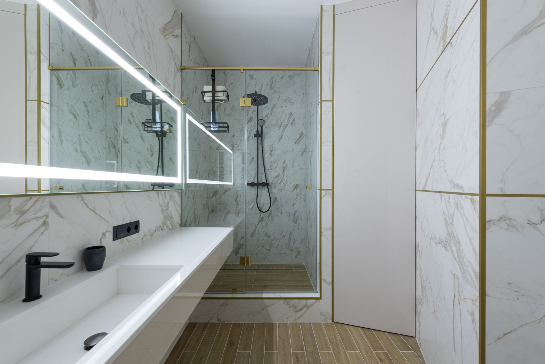 Modern bathroom renovation with marble-look wall tiles and walk-in shower
